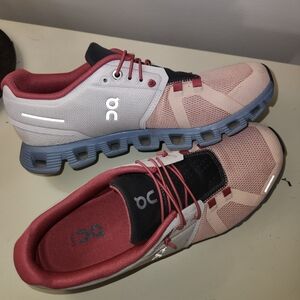 On Running Pink and Gray Athletic Shoes with Breathable Upper and Cushioned Sole